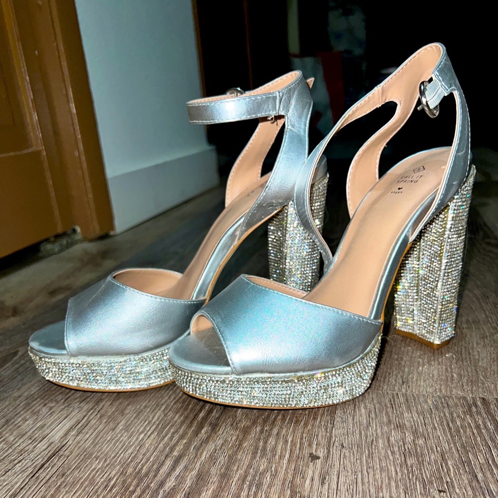 Beautiful rhinestone heels never worn. 5 inches In the heel.